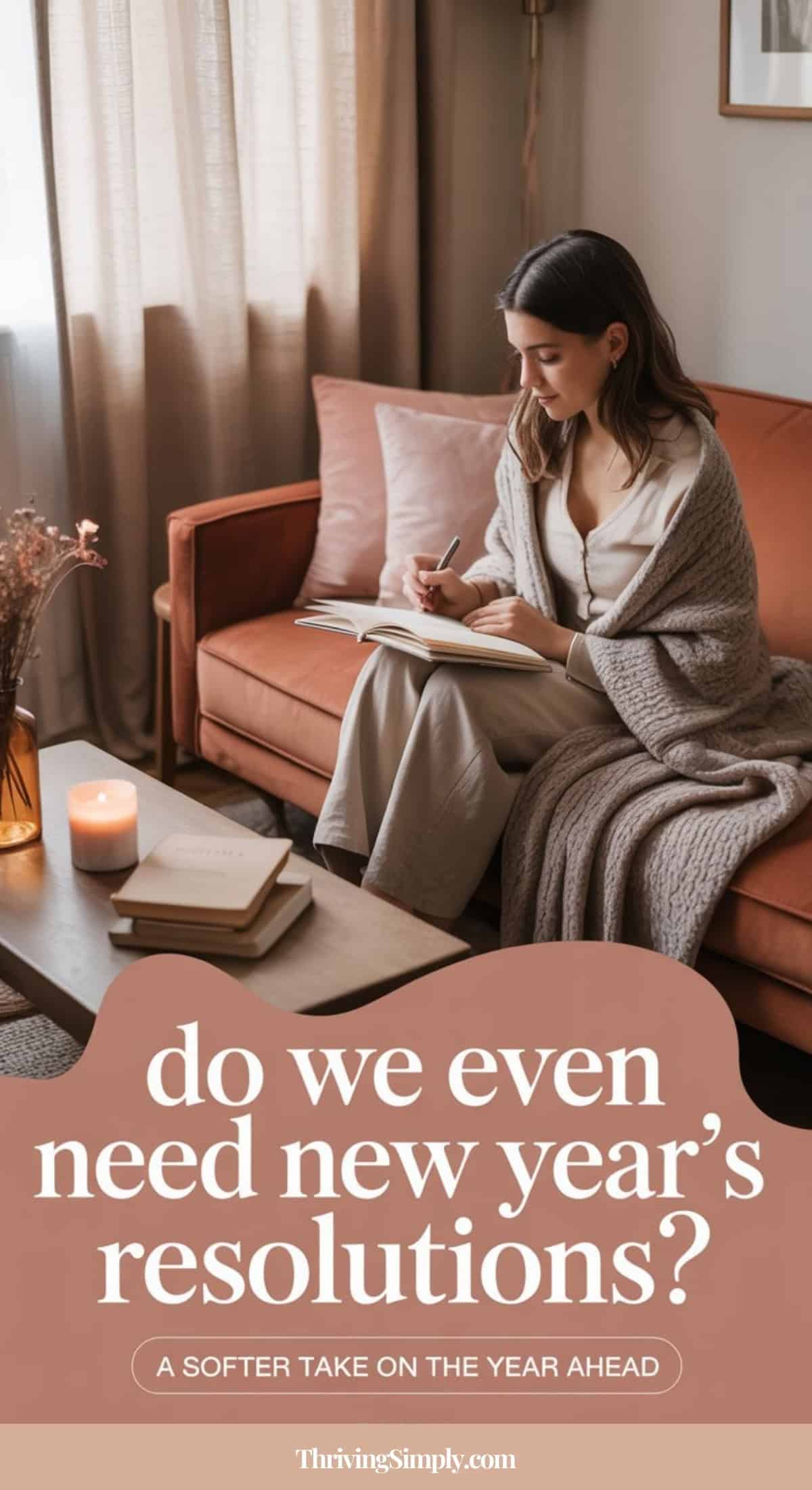 A woman sits on a sofa wrapped in a blanket, writing in a notebook. A candle and flowers are on the coffee table. Text reads: Rethink New Year’s Resolutions—a softer take on the year ahead. ThrivingSimply.com.