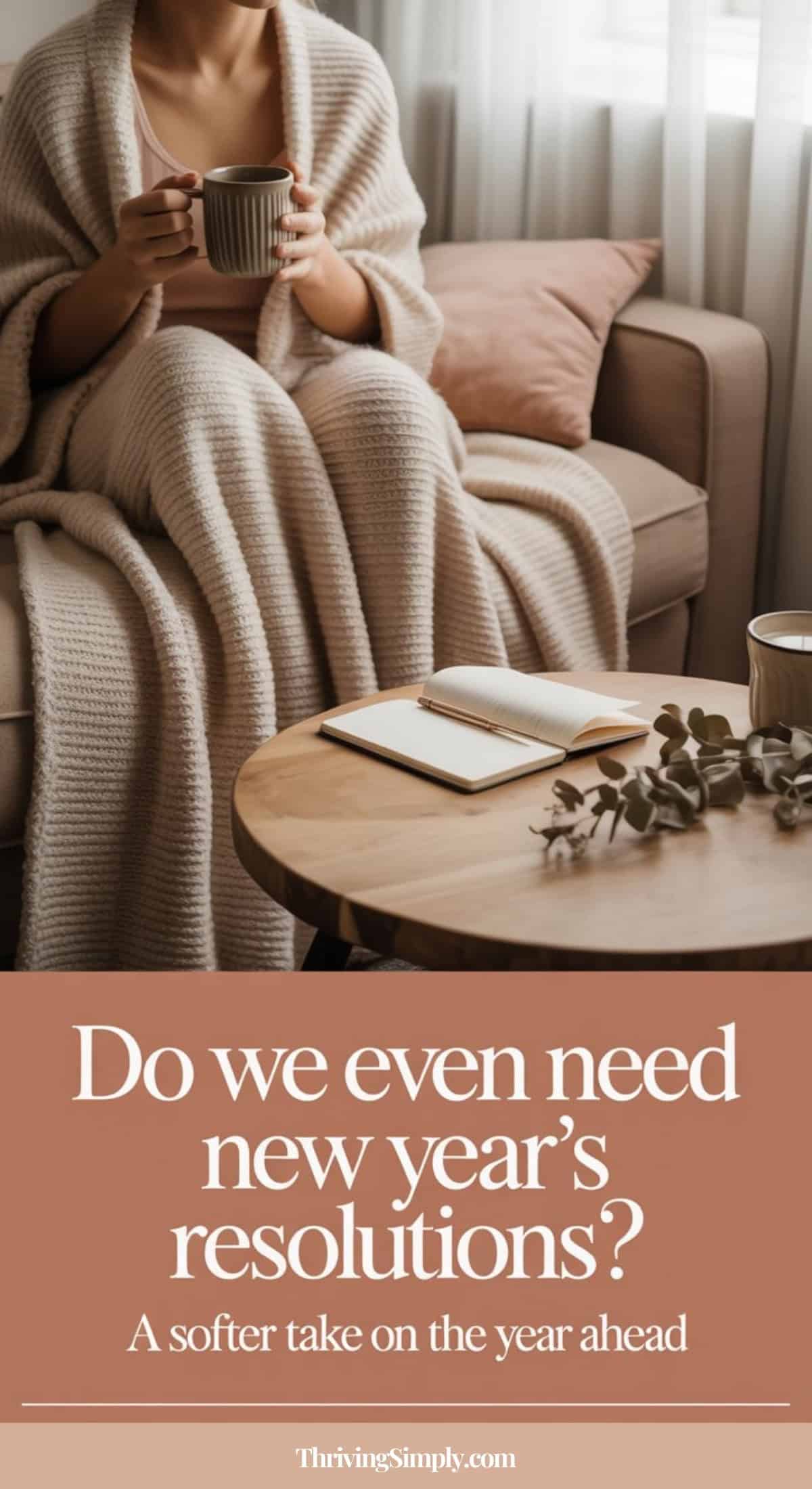 A person sits on a sofa wrapped in a cozy knit blanket, holding a mug. An open notebook and pen are on the coffee table. Text reads: “Do we even need New Year’s Resolutions? A softer approach to the year ahead.”.