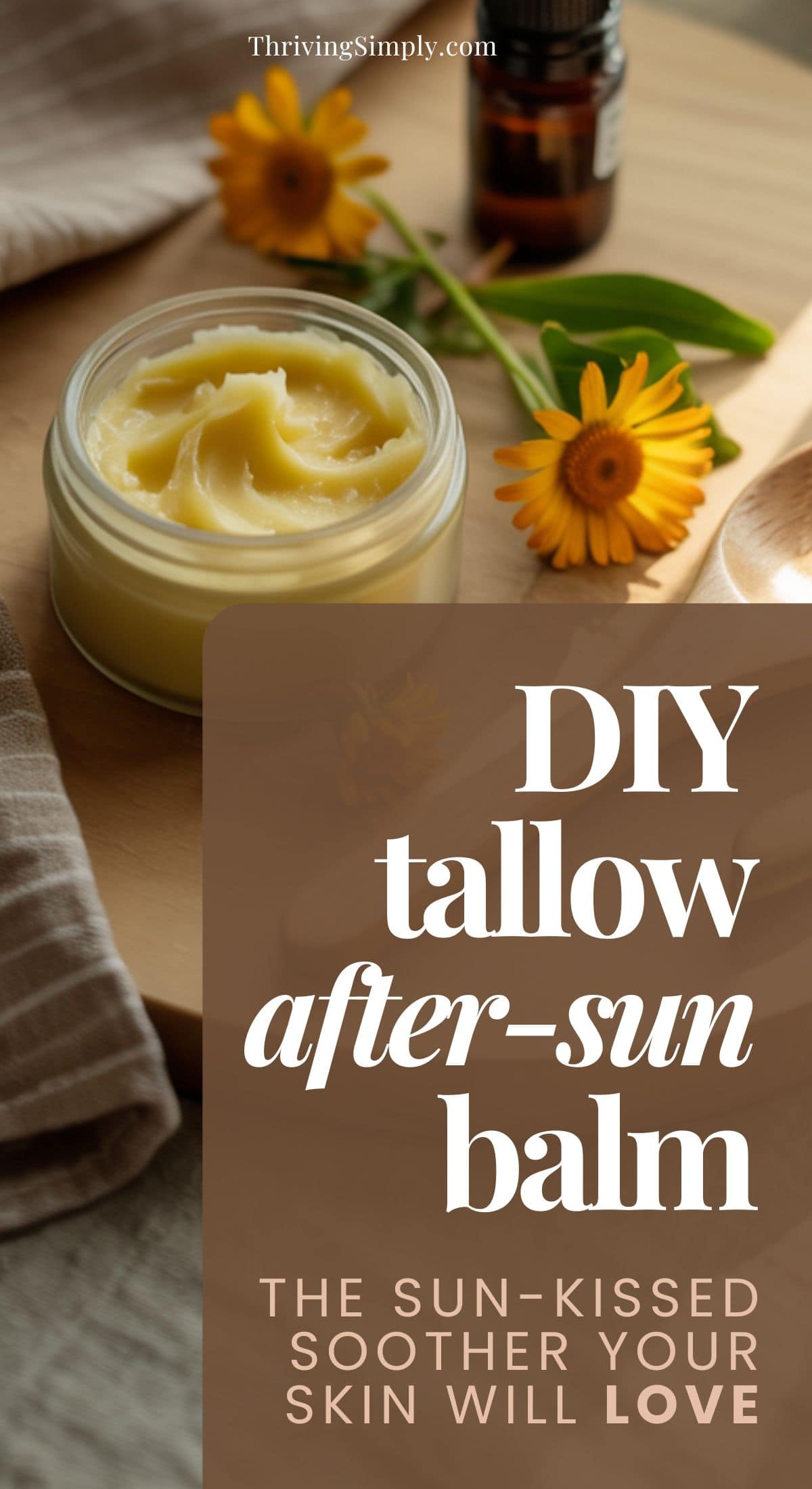 A glass jar of creamy tallow balm sits on a wooden tray beside a yellow flower and small brown bottle. Text overlay reads: DIY Restorative After-Sun Balm. The sun-kissed soother your skin will love.