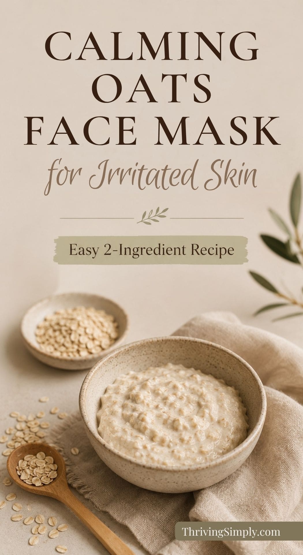 A bowl of creamy homemade face mask sits on a beige cloth next to a small bowl and a wooden spoon filled with oats. Text overlay reads: “Calming Oats DIY Face Mask for Tired Skin – Easy 2-Ingredient Recipe.”.